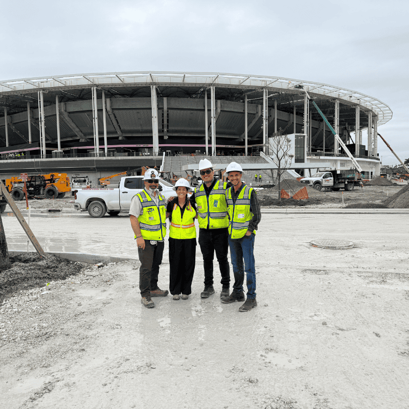 Josh Wolk, Maria Genge, Pablo Duran, and Christopher Mangin in front of the upcoming Nu Stadium