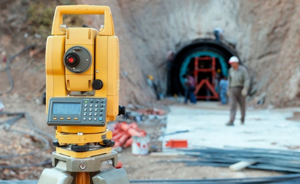 Surveying instrument set up on an active civil infrastructure site