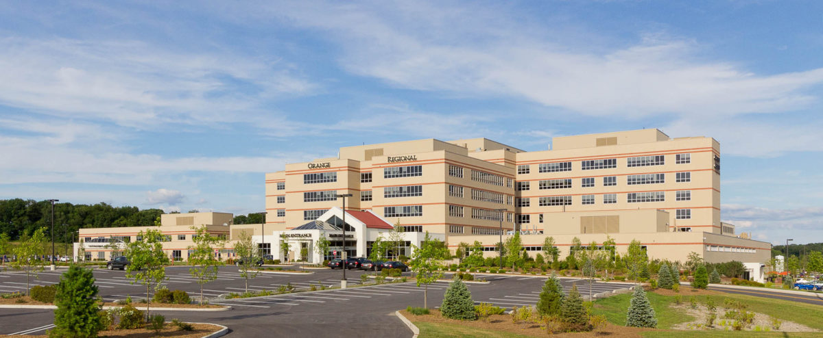 Front exterior view of a large, multi‑story regional medical center