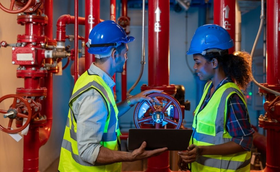 Engineers reviewing fire protection piping 