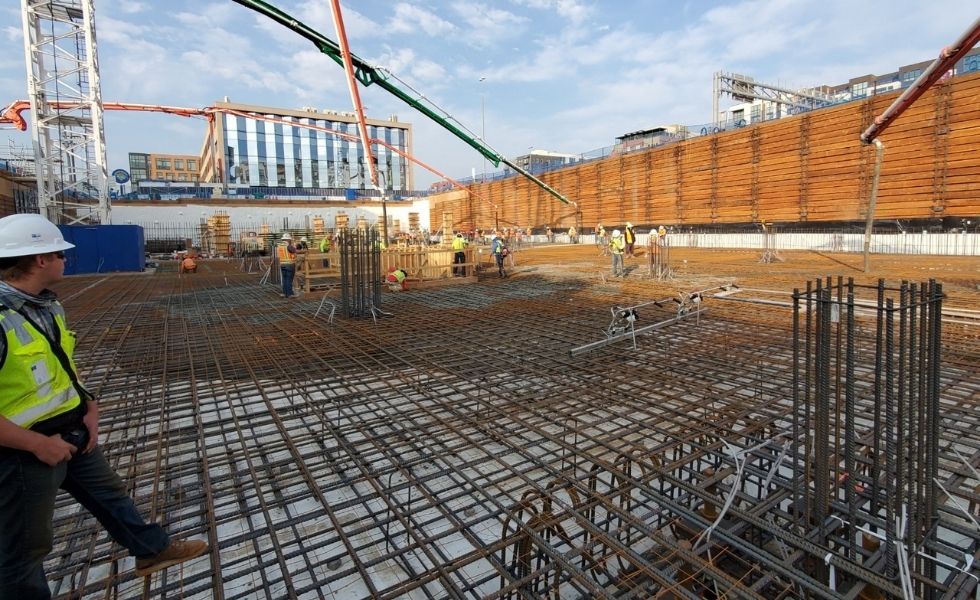 Construction workers installing steel reinforcement