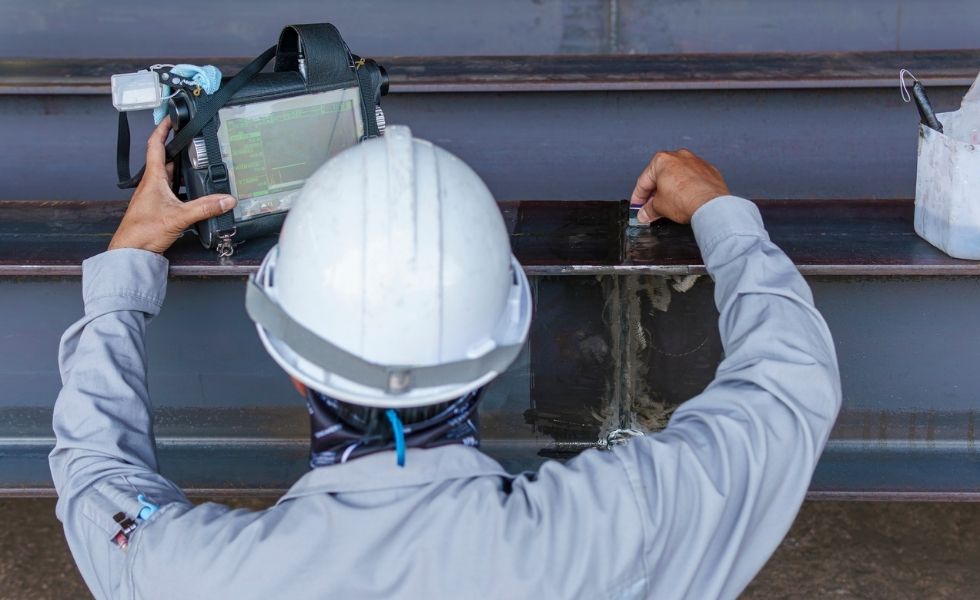 Field technician performing non-destructive testing 