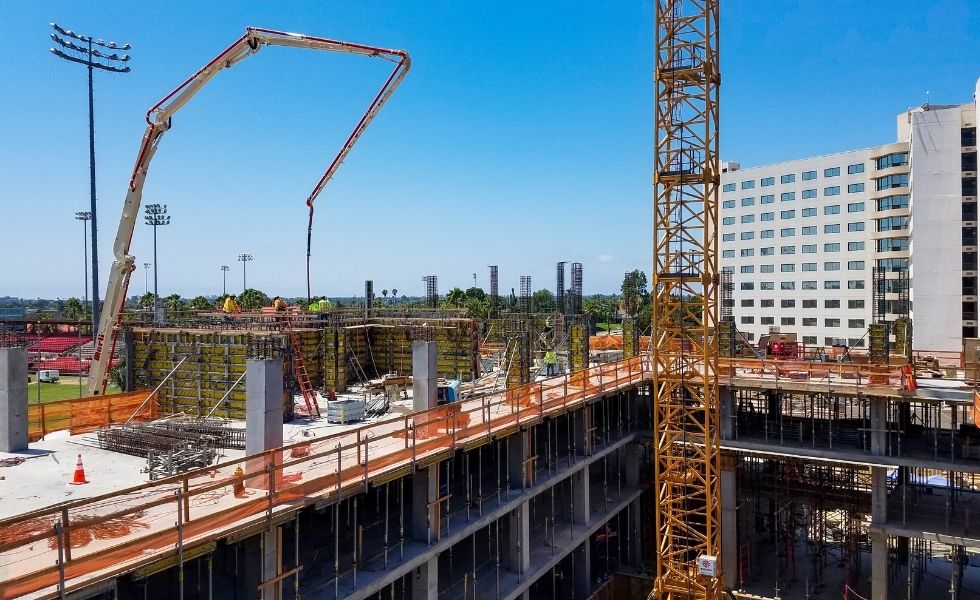 Multi-level construction site showing reinforced concrete structure progress