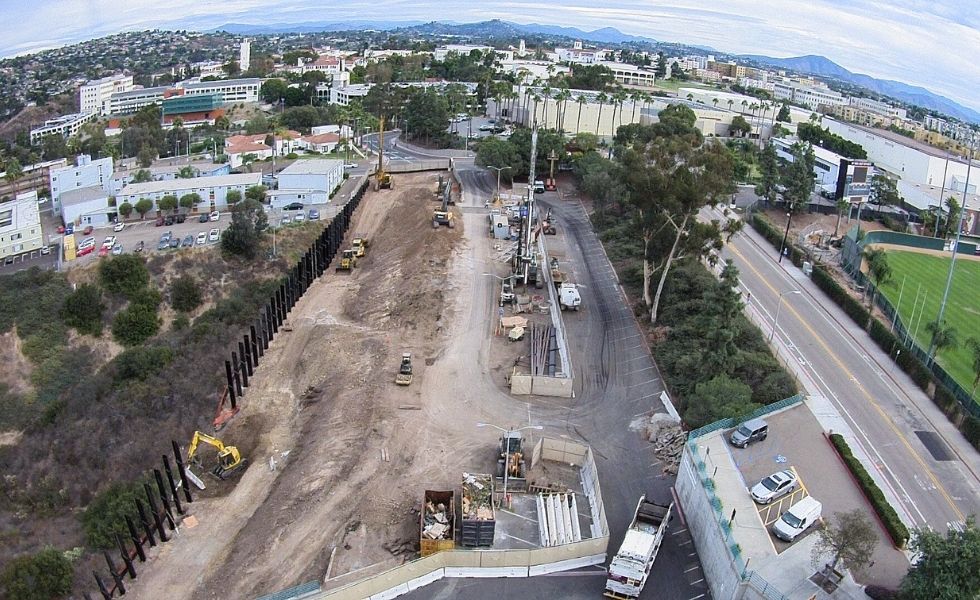 Aerial view of a large construction site showing early-stage excavation, grading, and installation