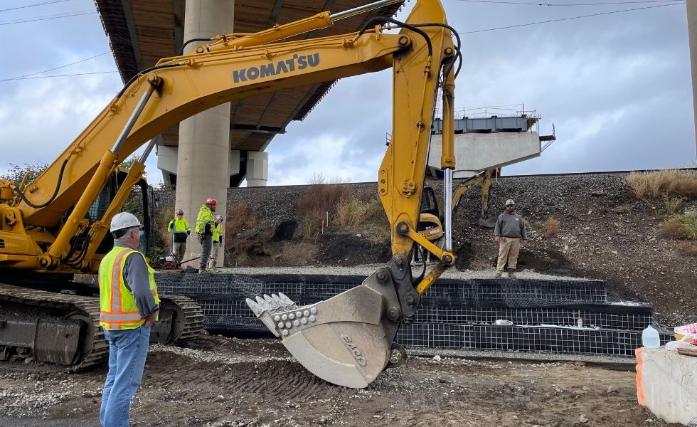 excavator at infrastructure improvement construction site