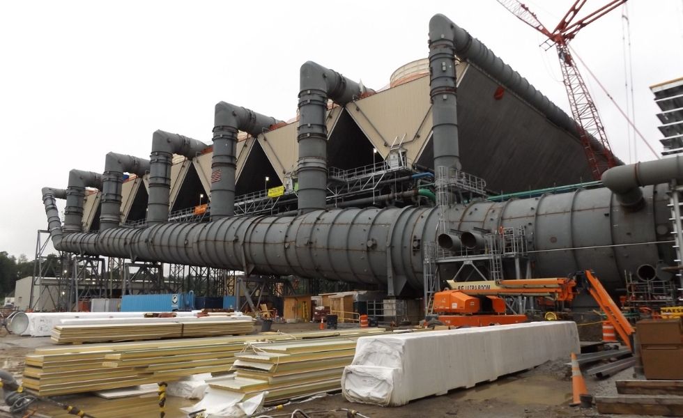 Cooling system installation at the CPV Valley Energy Center in Waywayanda, New York, featuring large industrial ducts, cooling structures, and power plant construction equipment.