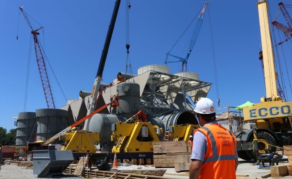 Heavy equipment installation at the CPV Valley Energy Center in Waywayanda, New York, featuring cranes, industrial components, and power plant construction activities.