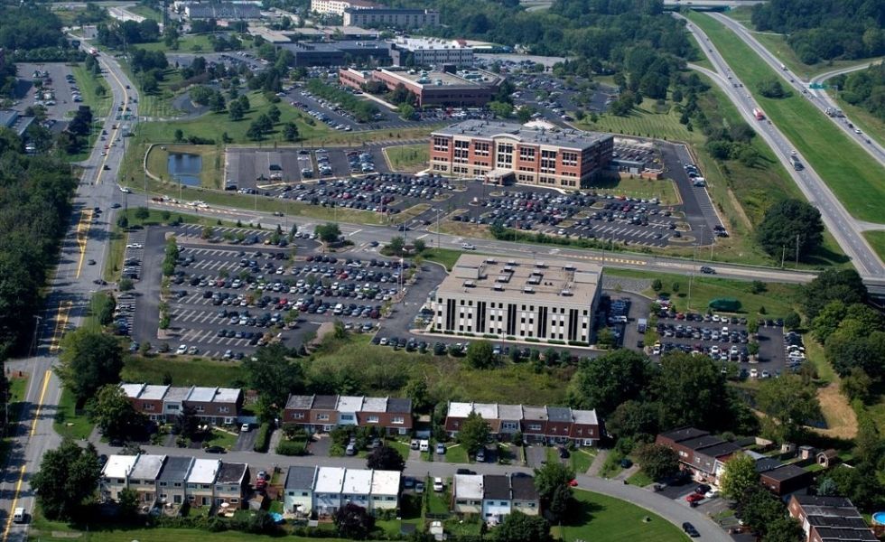 Aerial view of the Crystal Run Healthcare campus in New York, showing multiple medical buildings, parking areas,