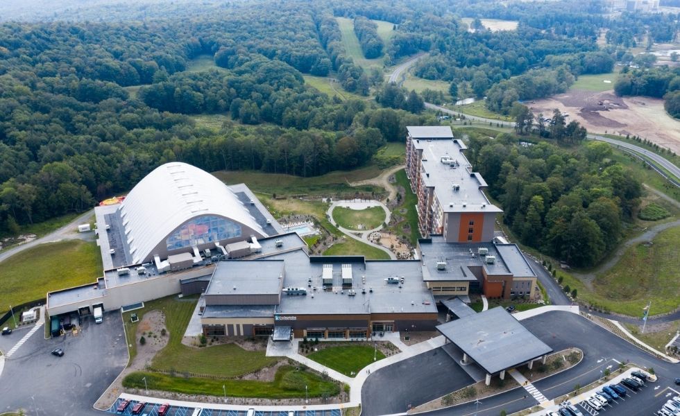 Aerial view of The Kartrite Resort & Indoor Water Park, NY, featuring the completed indoor water park, resort buildings