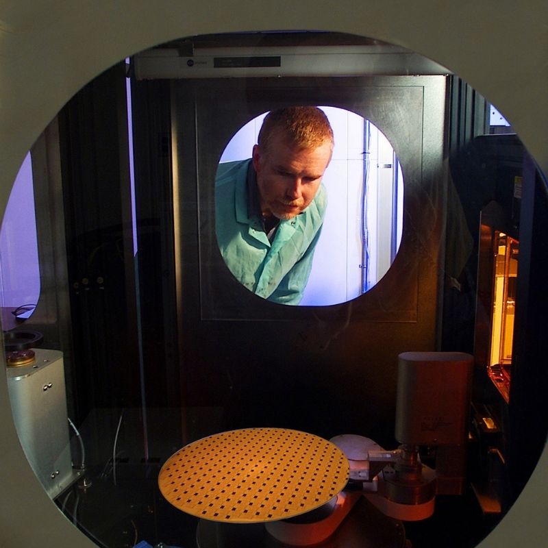 IBM 300MM Project - View through a circular observation window into a semiconductor wafer inspection chamber.