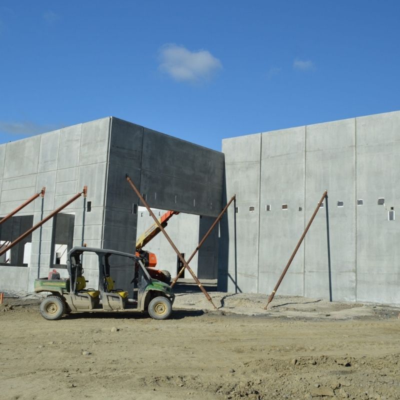 Precast concrete wall panels being installed during construction of the United Natural Foods Distribution Facility in Wallkill, NY, a 525,000-square-foot refrigerated distribution center.