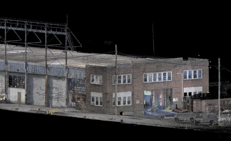 Top-down laser scan point cloud of the Pier 82S facility, illustrating the open storage yard, building roofline, circulation areas, and site layout used for rehabilitation planning and existing conditions documentation.