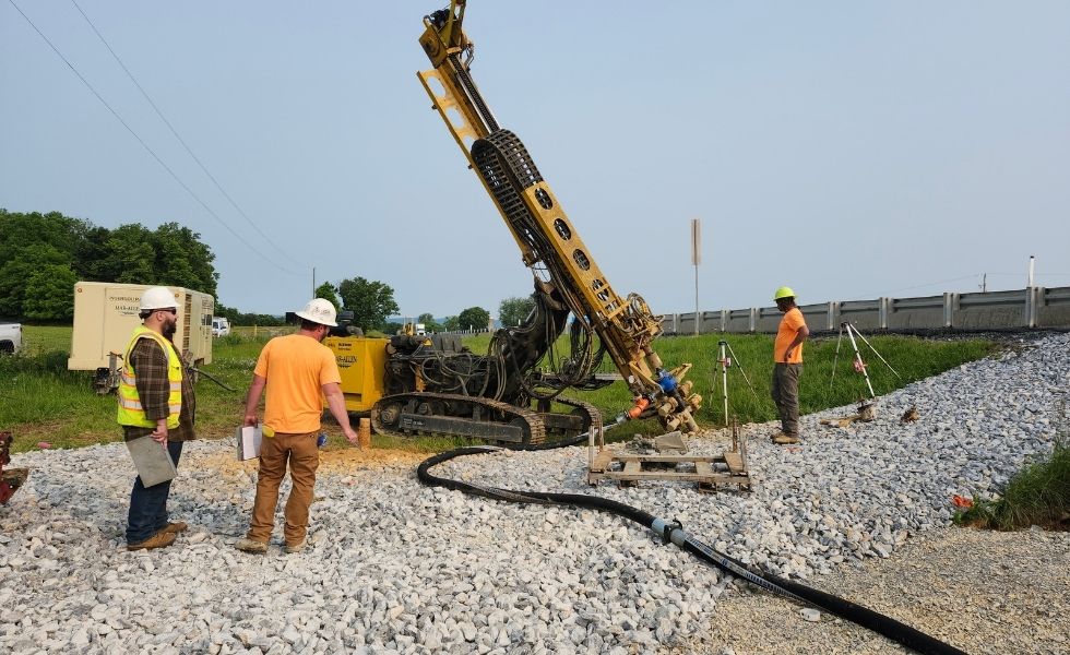 Field personnel conducting a subsurface drilling investigation for the Open-End Geotechnical Services Contract, using geotechnical drilling equipment and monitoring instruments