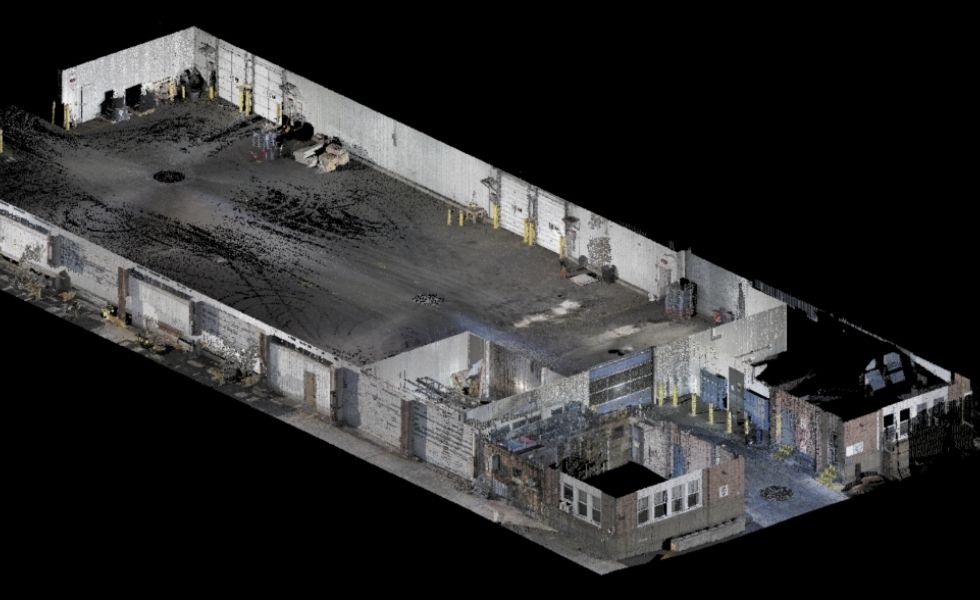 Ground-level point cloud view of the exterior façade at Pier 82S, showing warehouse doors, brick office sections, windows, utility poles, and adjacent roadway conditions.
