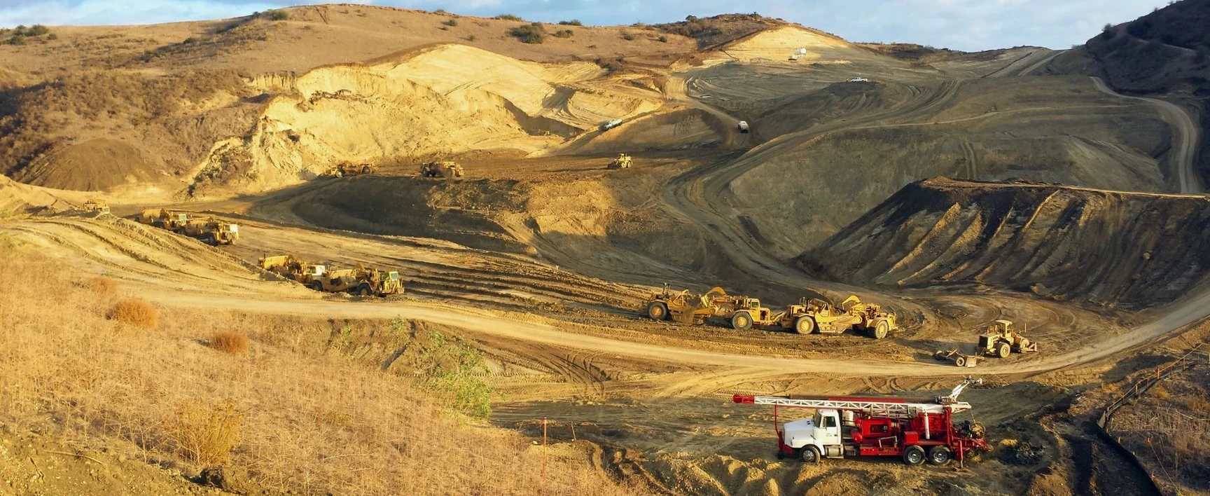 Heavy machinery working in a large open-pit mine