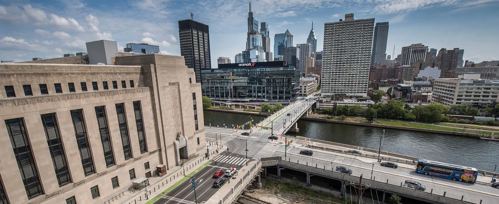 Aerial view of a cityscape showing a bridge crossing a river
