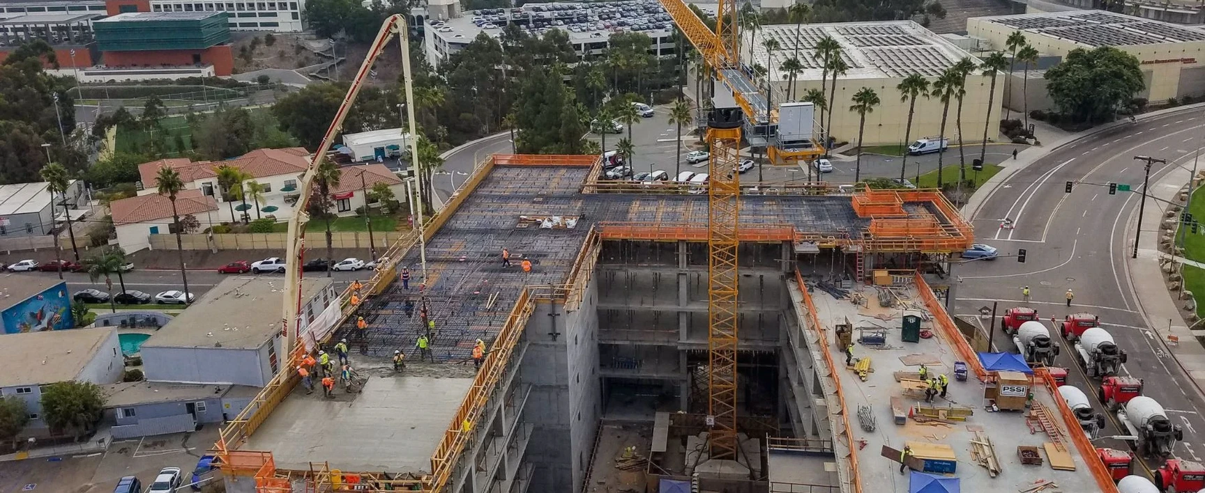Aerial view of a construction site showing large-scale earthworks and excavation
