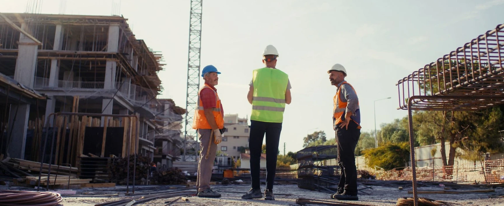 Engineers discussing plans on a construction site