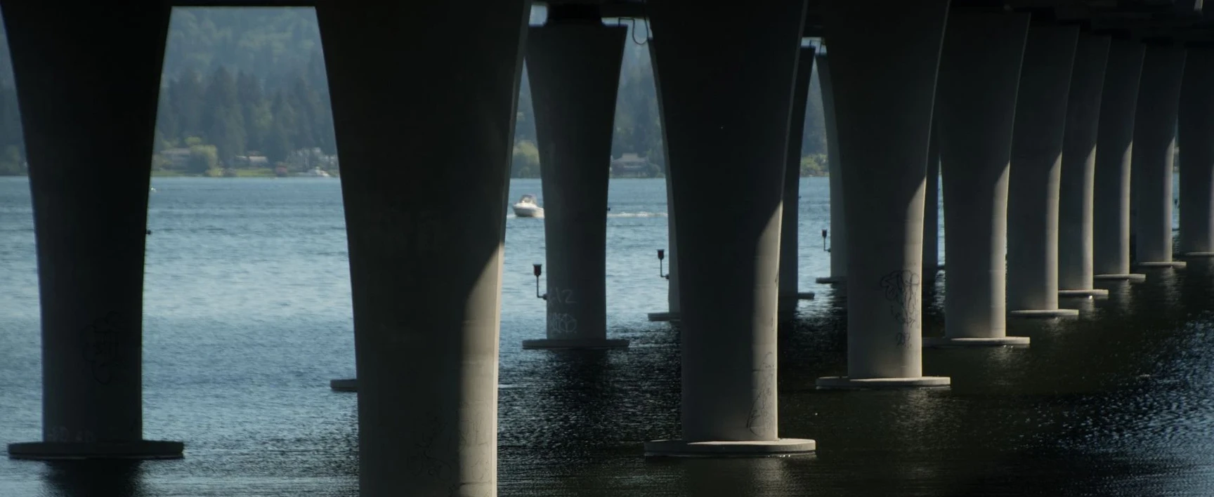 View of the bridge support piers beneath the SR 520 Bridge Replacement and HOV Program crossing over Lake Washington
