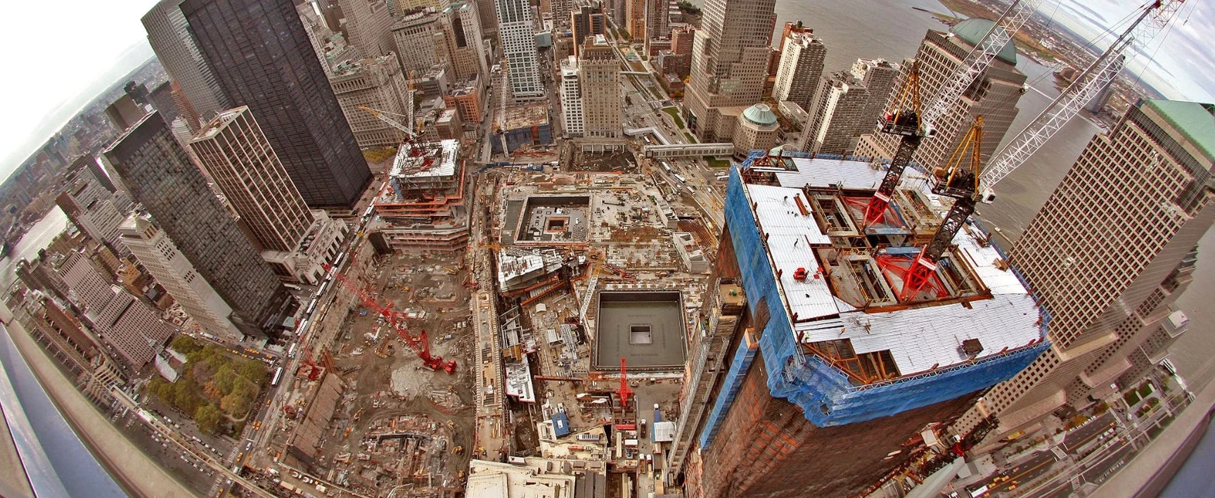 Reconstruction of the World Trade Center Complex in New York, showing the redevelopment of the site with modern skyscrapers, transportation infrastructure, and public spaces.