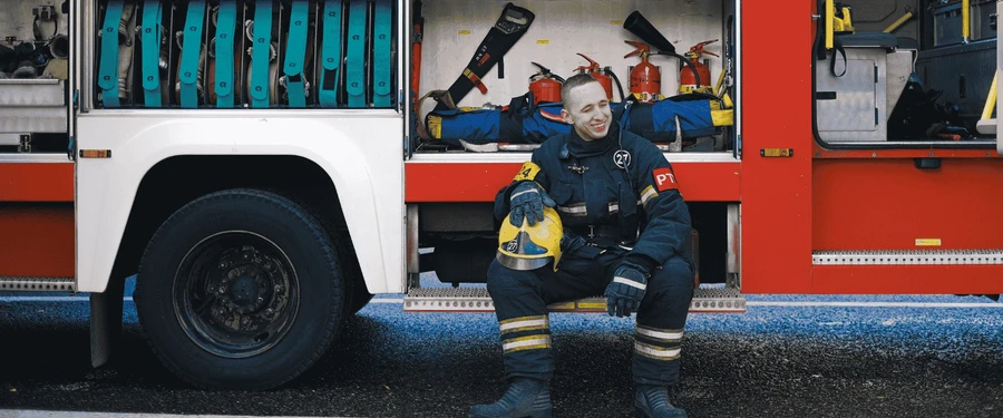 Emergency Radio Communication Systems help Emergency Responders. Picture shows a firefighter. 