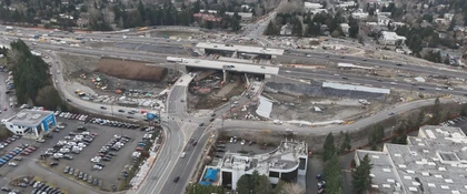 Aerial view of the I-405 Northeast 85th Street Interchange and Inline BRT Station Project showing an active highway interchange construction site with multiple overpasses