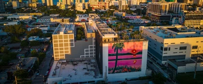 Aerial view of the Miami Design District, featuring contemporary buildings, colorful murals, and the surrounding Miami cityscape.